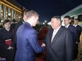 North Korean leader Kim Jong Un shakes hands with Alexander Kozlov, Russia's minister of natural resources and ecology, upon arrival at the Khasan Railway Station in Khasan, Russia, on September 12, 2023.