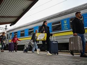 Ukrainians at train station in Poland