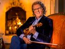 André Rieu reclines with one of his vintage instruments. Rieu plays in Ottawa this week. 