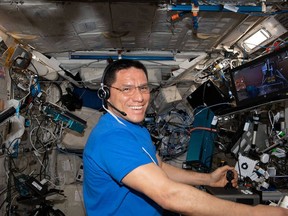 In this image from July 24, 2023, NASA astronaut Frank Rubio operates a remote-control experiment on the International Space Station.