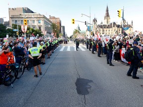 Protesters separate by police