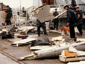 Irish naval authorities bring ashore debris from an Air India Boeing 747, 28 June 1985 in Cork, Ireland. T