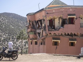 Foreign Affairs Minister Mélanie Joly has urged Canadians in Morocco to register with Global Affairs Canada after a deadly earthquake struck the country late Friday night. A man stands next to a damaged hotel after the earthquake in Moulay Ibrahim village, near the epicentre of the earthquake, outside Marrakech, Morocco, Saturday, Sept. 9, 2023.