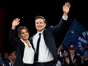 Poilievre and his wife waving