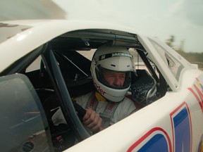 Mississauga firefighter and race car driver Larry Jackson is shown behind the wheel in a still frame from a Wonder Bread commercial in a handout photo.
