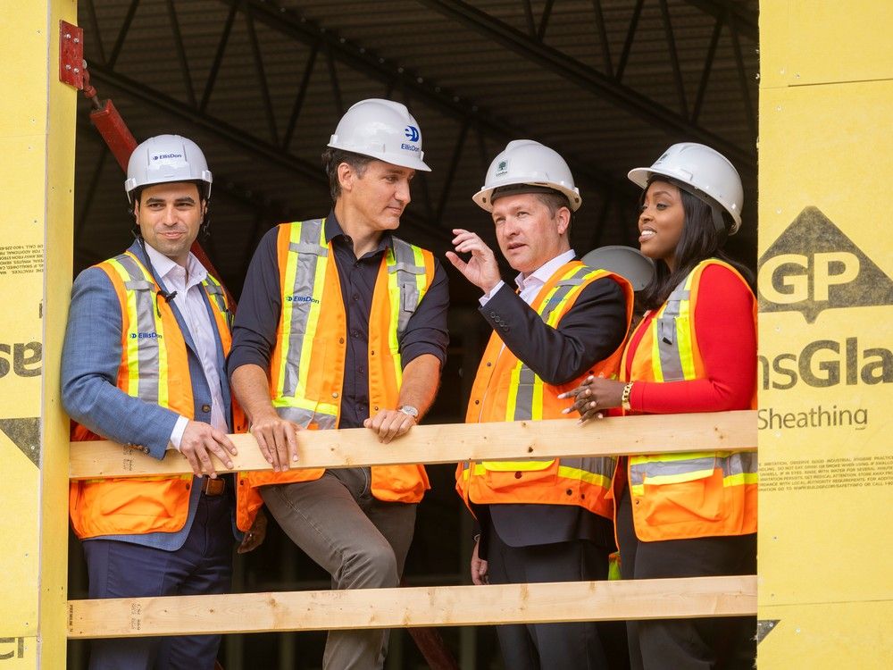 Prime Minister Justin Trudeau, second from left, is shown in London, Ont. this week inspecting an accessible housing project alongside local politicians.  