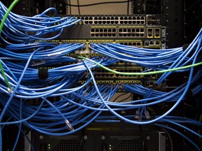 Networking cables and circuit boards are shown in Toronto on Wednesday, November 8, 2017. The parent company of The Weather Network says it was affected by a cybersecurity incident that took down some of its data systems.