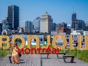 Tourisme Montreal's selfie station reading "Bonjour Montréal" in giant letters at the Grand Quay of the Port of Montreal.