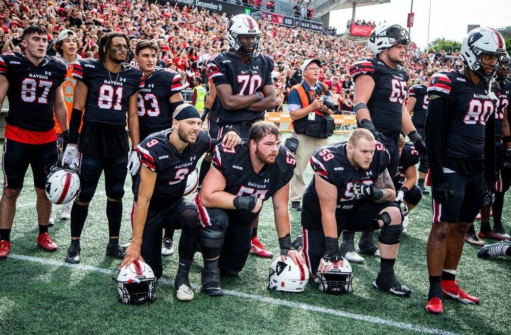Raven's players watch in the last minutes of the nail-bitter of a game as the Gee-Gees kicked a field goal to win the game.