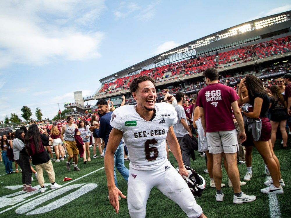 Gee-Gees Aymane El Aasri celebrate the huge win on the field Sunday afternoon