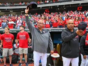 Manager Terry Francona of the Cleveland Guardians waves to the fans prior to the game against the Cincinnati Reds at Progressive Field.