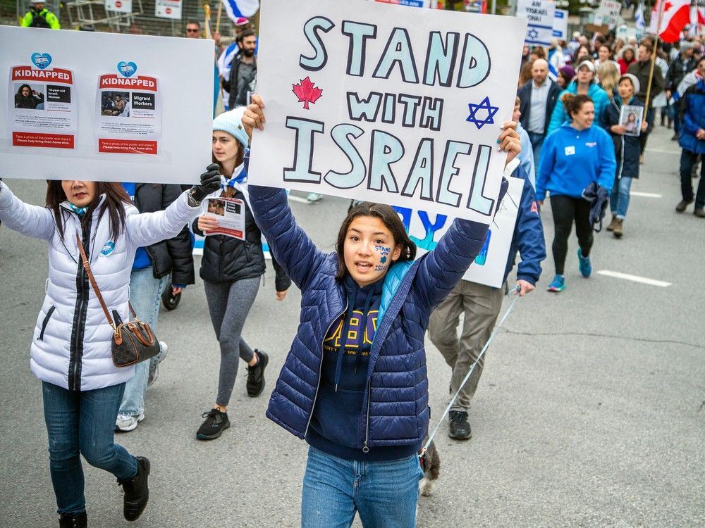 A rally in support of Israel started at City Hall and participants marched to Parliament Hill where speeches took place Sunday, October 15, 2023.
