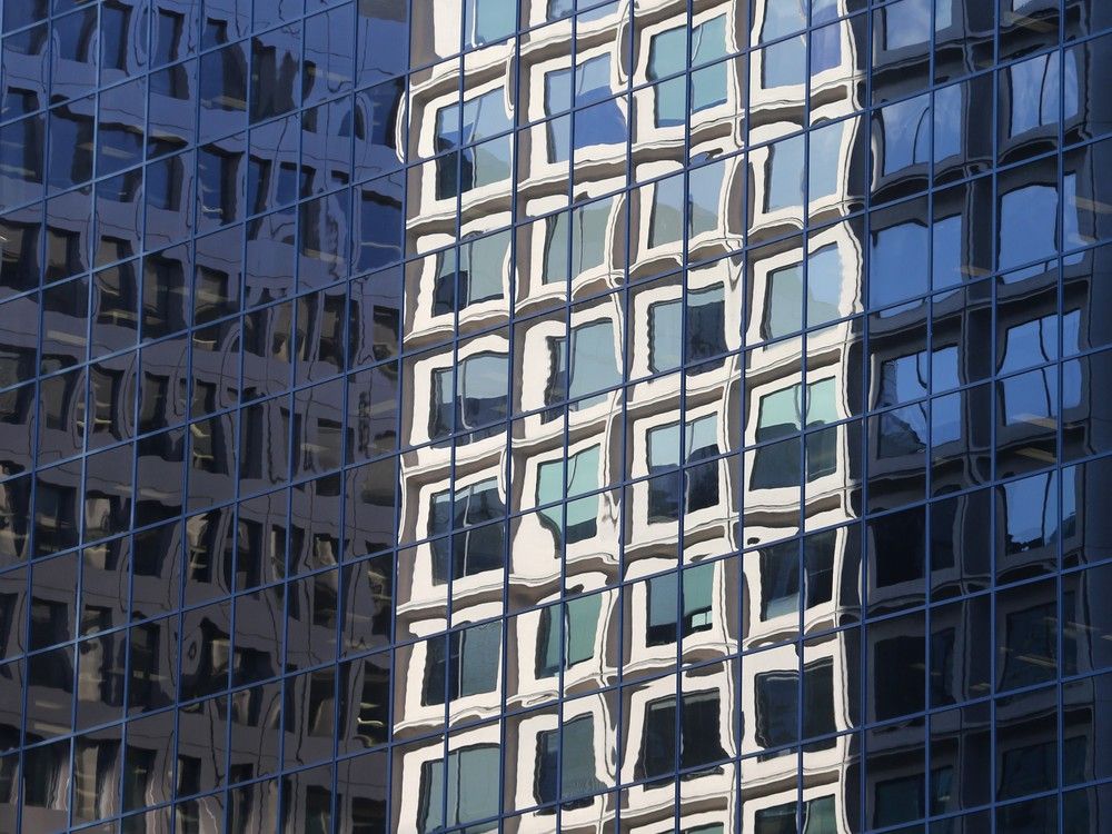 Empty offices in the downtown core of Ottawa are reflected in this photo from November 2020.