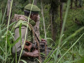A soldier of the FARDC (Armed Forces of the Democratic Republic of the Congo) takes position during exchanges of fire with members of the ADF (Allied Democratic Forces) in Opira, North Kivu, on January 25, 2018.