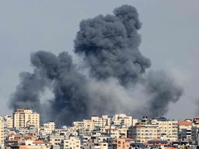Smoke billows over Gaza City on October 7, 2023 following an Israeli air strike.