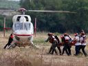 Israeli rescue teams evacuate the wounded by helicopter near the southern city of Sderot on October 7, 2023.