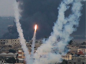 Palestinian militants fire rockets towards Israel from Rafah, southern Gaza Strip, on Oct. 11.