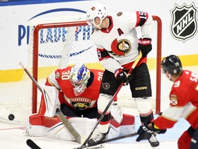 Ottawa Senators forward Drake Batherson (19) deflects a shot in front of Florida Panthers goaltender Spencer Knight