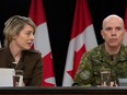 Minister of Foreign Affairs Melanie Joly speaks with Chief of the Defence Staff Wayne Eyre