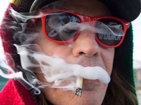 Bill Semeniuk, 67, smokes cannabis in Kamloops, B.C. Wednesday, Oct. 17, 2018.