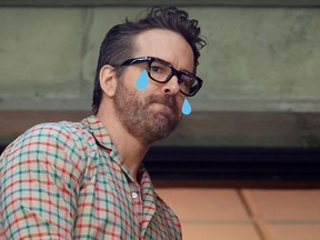 A picture of Ryan Reynolds, with poorly photoshopped blue tears falling from his eyes.
