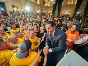 Manitoba NDP Leader Wab Kinew greets supporters after winning the Manitoba provincial election in Winnipeg on Tuesday, Oct. 3, 2023.