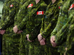 The military's chaplain-general says many soldiers are struggling with the high cost of living and morale is the lowest it's been in recent memory. Canadian Forces personnel stand easy at CFB Kingston in Kingston, Ont., Tuesday, March 7, 2023.