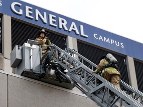 Firefighters work at the scene of a fire at the General campus of The Ottawa Hospital on Friday.