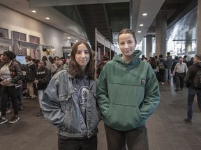 Beatrice Dion, left, who was born in Quebec, and Coco Clement, from Vancouver, attend an open house at Concordia University in Montreal on Saturday.