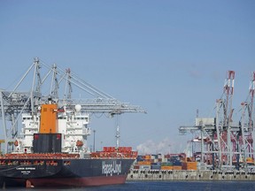 Container ships are shown in the Port of Montreal on January 4, 2016. Workers represented by Unifor at the St. Lawrence Seaway Corp. have voted 99 per cent in favour of a strike if they are not able to reach a new contract.