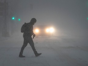 vehicle headlights in snowstorm