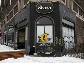 The boarded up storefront of the Shaika coffee shop