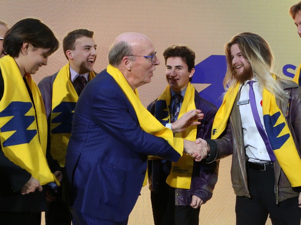 Stephen R. J. Smith, shakes hands with Queen's University engineering students following a ceremony marking Smith's $100-million donation to the university's engineering faculty in Kingston, Ont. on Thursday, Nov. 2, 2023. 
Elliot Ferguson/The Whig-Standard/Postmedia Network
