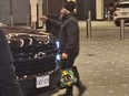 Jagmeet Singh carrying a bag with a Versace logo