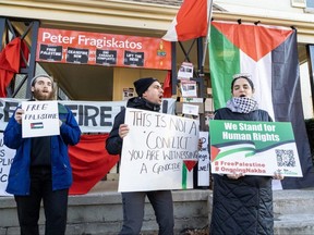 Dr. Tarek Loubani (middle) was protesting with about 40 other supporters of Palestine at the constituency office of MP Peter Fragiskatos in London on Wednesday November 15, 2023. (Derek Ruttan/The London Free Press)