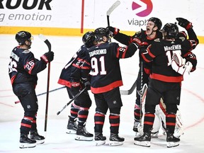 The Ottawa Senators celebrate after defeating Minnesota on Saturday in Stockholm.