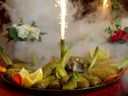 Abdullah Alosman, who is the chef/owner of Al Halabi Restaurant, was a Syrian refugee to Canada half a dozen years ago. 
Platters of lamb mandi, tabouli, hummus and stuffed zucchini are served with sparklers and dry ice that add  flair and drama to the dining experience at Al Halabi.
