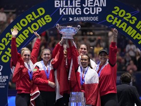 Canada's Leylah Fernandez, right, lifts the trophy with members of her team