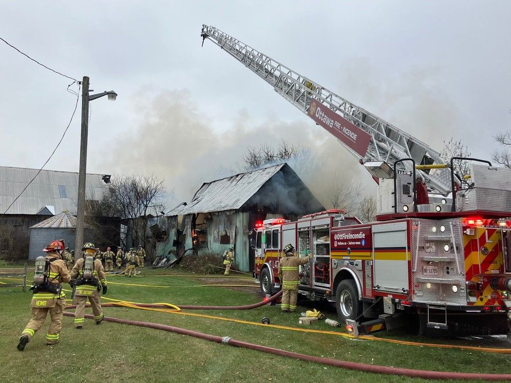 Ottawa Fire Services crews battle a blaze on First Line Road on Monday, Nov. 6, 2023.