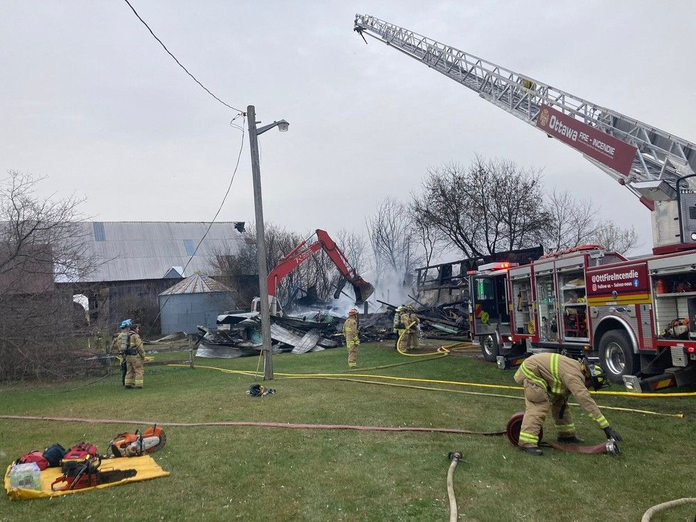 Ottawa Fire Services crews battle a blaze on First Line Road on Monday, Nov. 6, 2023.