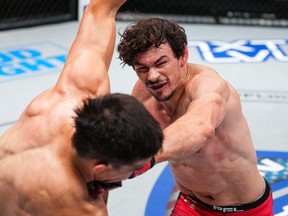 Olivier Aubin-Mercier, right, throws a punch in his PFL lightweight semifinal win over Paraguay's Alex Martinez