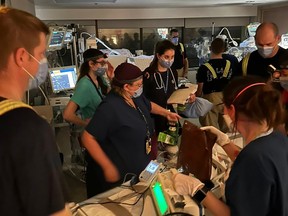 Firefighters and hospital staff relocating babies from ICU to CHEO