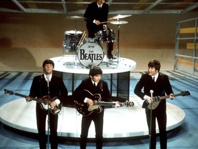 FILE -The Beatles, foreground from left, Paul McCartney, George Harrison, John Lennon and Ringo Starr on drums perform on the CBS "Ed Sullivan Show" in New York on Feb. 9, 1964. Sixty years after the onset of Beatlemania and with two of the quartet now dead, artificial intelligence has enabled the release of a "new" Beatles song."Now And Then," will be available Thursday, Nov. 2.