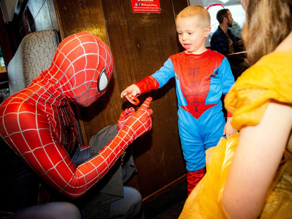 Four-year-old Easton Adams was so excited to see Spider-Man and give him one of his team shirts