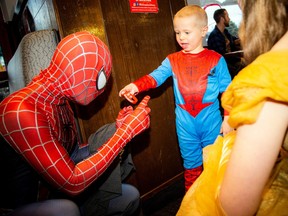 Four-year-old Easton Adams was so excited to see Spider-Man and give him one of his team shirts
