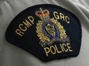A Royal Canadian Mounted Police (RCMP) crest is seen on a member's uniform, at the RCMP