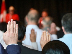 Canadians from 24 countries being sworn in during a citizenship ceremony June 2023.