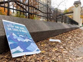 A sign from a recent student protest rests against the wall leading to the Roddick Gates at McGill University in Montreal Friday November 3, 2023.