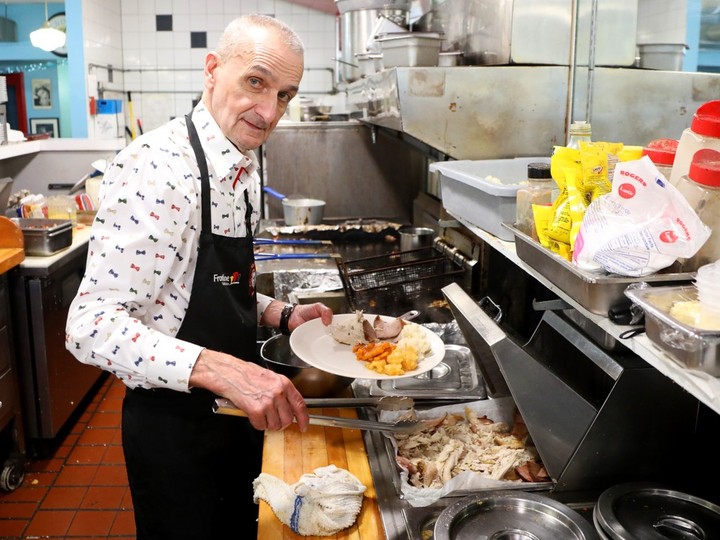  Manager John Zacher prepares a warm turkey meal at the Bramasole Diner on Christmas Day.