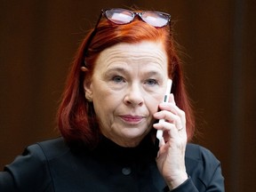 Catherine Tait, President and CEO of the Canadian Broadcasting Corporation (CBC) talks on the phone before appearing at the Standing Committee on Canadian Heritage in Ottawa, on Thursday, Nov. 2, 2023.